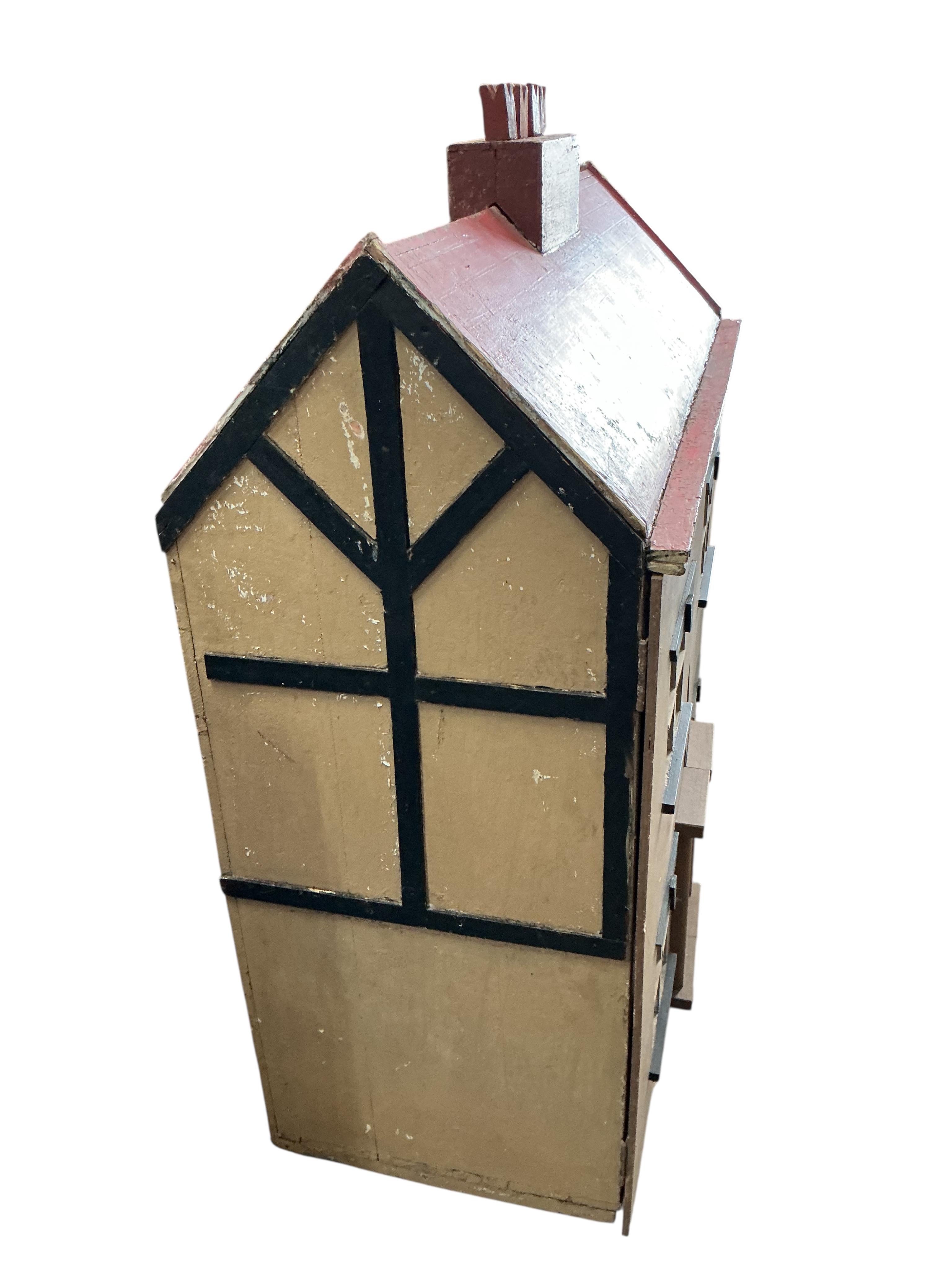 A mid century painted wood doll's house, width 96cm, depth 45cm, height 120cm